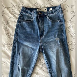 Garage brand blue skinny jeans with rips